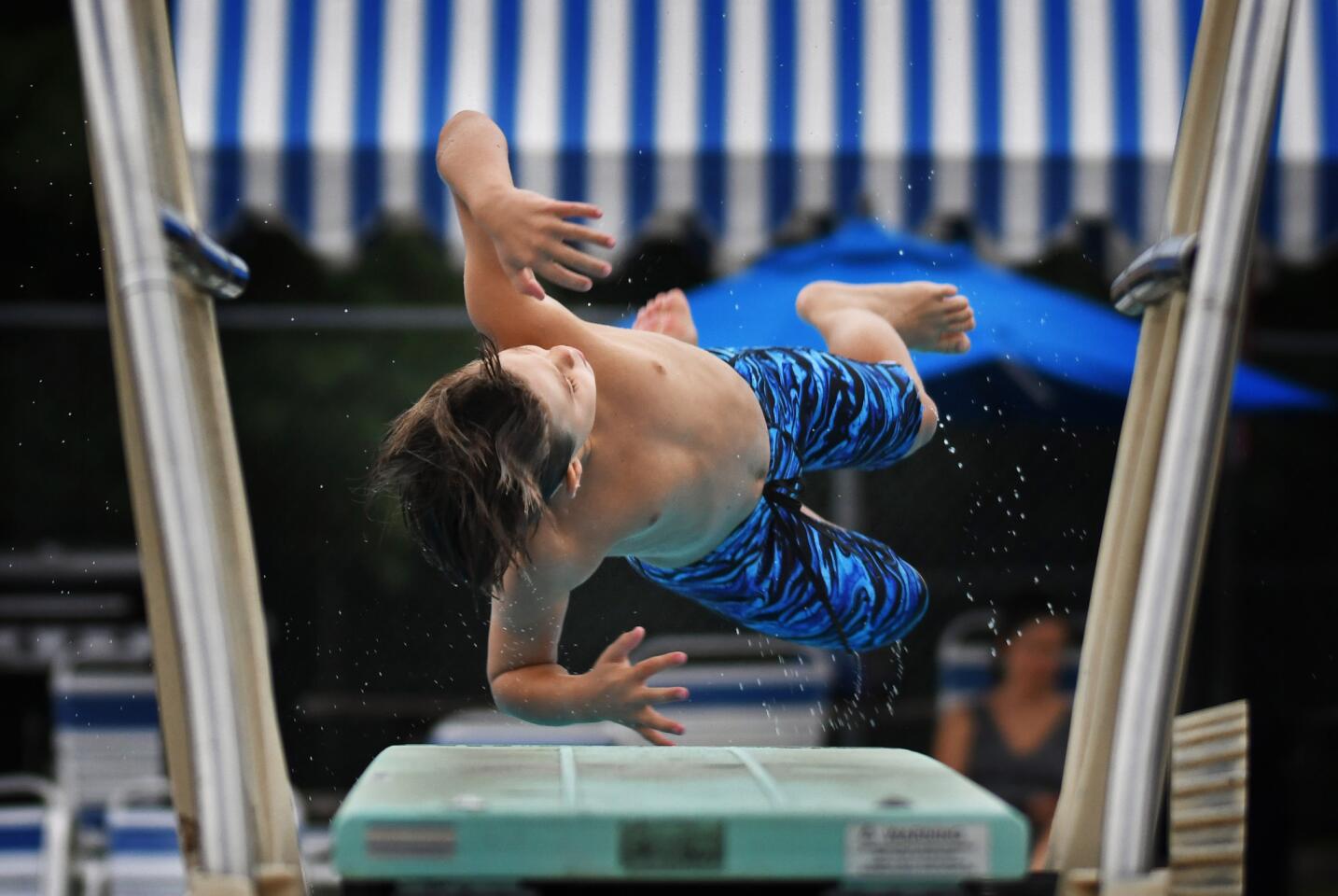 North Saint Johns' Luke McGill makes one of his dives against West Howard in youth diving competition.