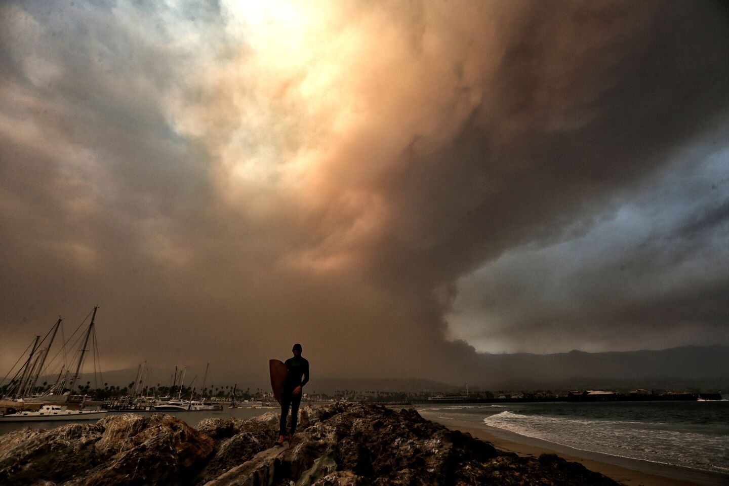 Smoke billows over Santa Barbara as the Thomas Fire continues to threaten the area on Saturday.