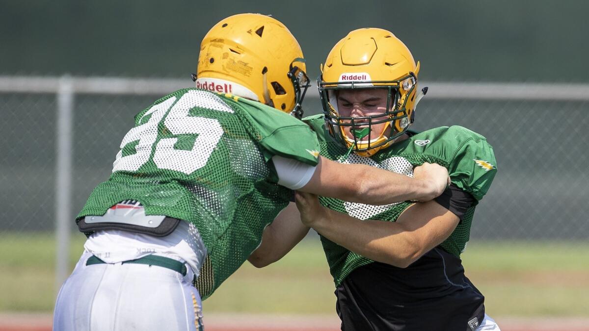 Edison High senior linebacker Luke Hoggard, right, has received an offer from Brown. He earned All-CIF Southern Section Division 2 honors last season.