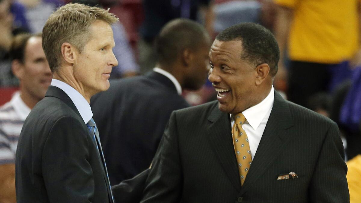 Golden State Warriors Coach Steve Kerr, left, is congratulated by assistant coach Alvin Gentry after a win over the Sacramento Kings on Oct. 29.