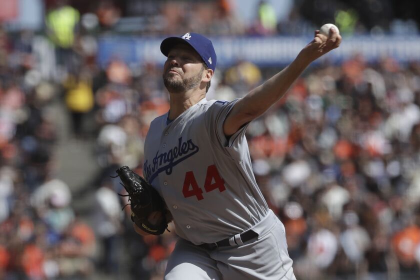 Los Angeles Dodgers starting pitcher Rich Hill throws to a San Francisco Giants batter during the first inning of a baseball game in San Francisco, Sunday, Sept. 29, 2019. (AP Photo/Jeff Chiu)