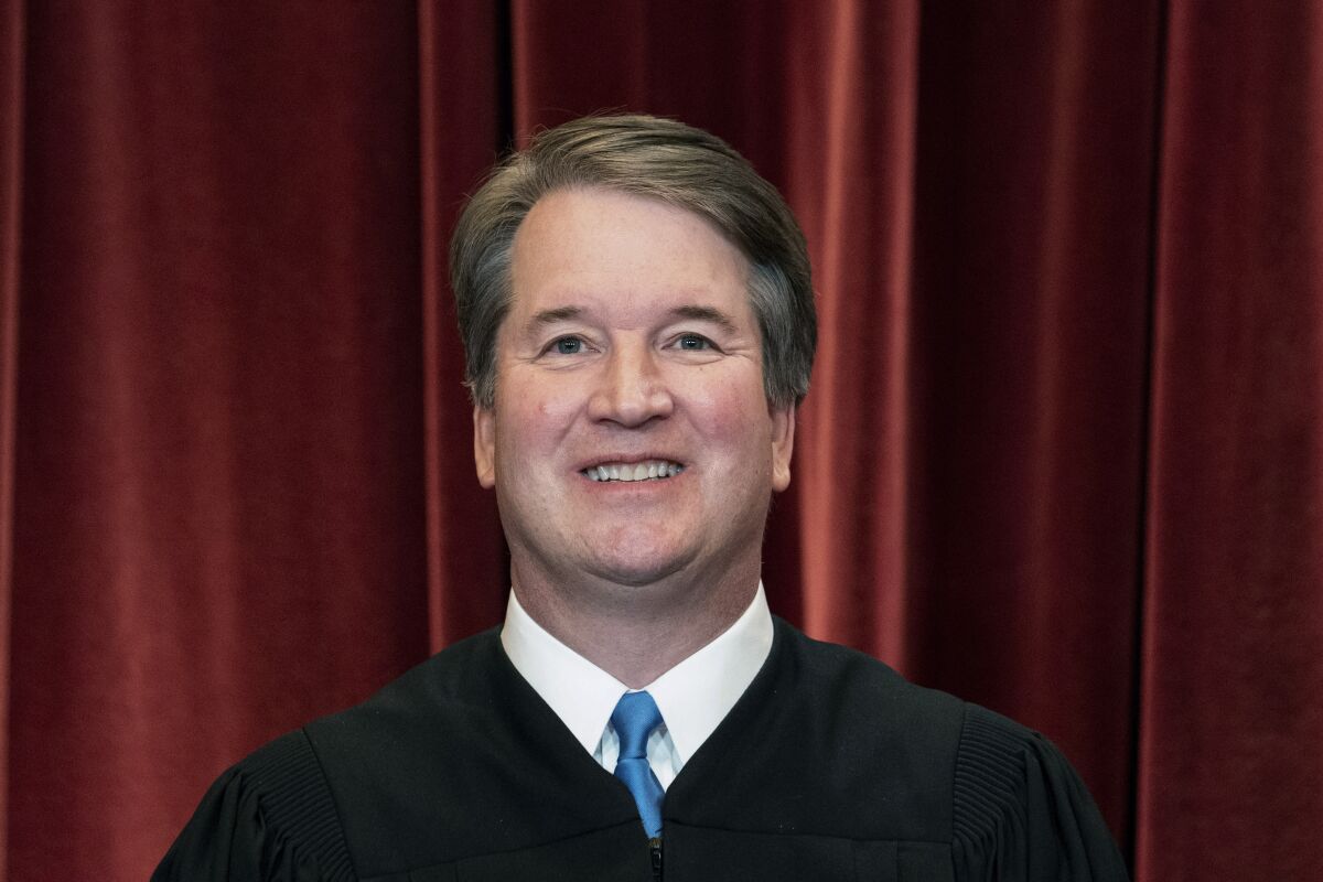 FILE - Associate Justice Brett Kavanaugh stands during a group photo at the Supreme Court in Washington