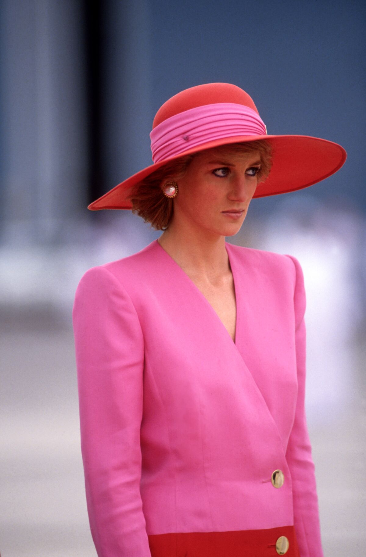 March 1989: Visiting Dubai, Diana Princess of Wales wears a color-blocked pink and red dress by Catherine Walker.