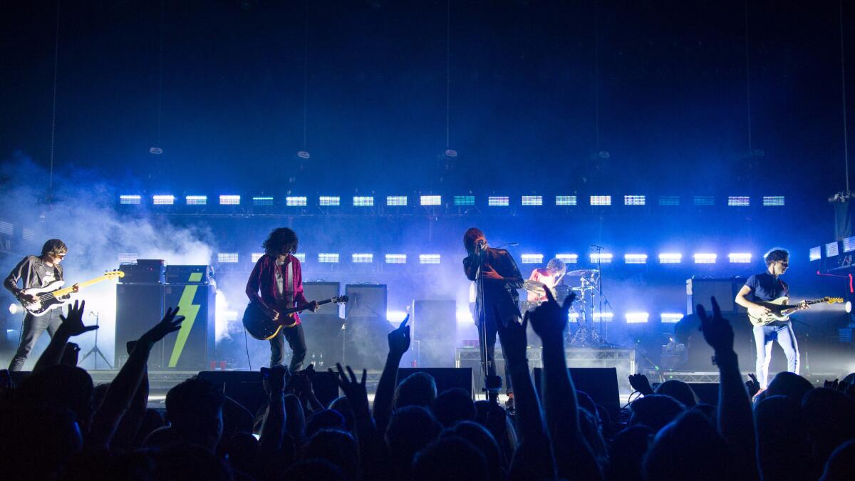 The Strokes perform at a benefit for a number of L.A. homeless charities on Monday evening.