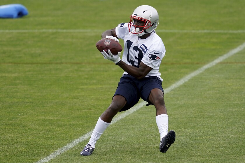 New England Patriots wide receiver Nelson Agholor makes a catch during NFL football practice in Foxborough, Mass., Friday, June 4, 2021. (AP Photo/Mary Schwalm)