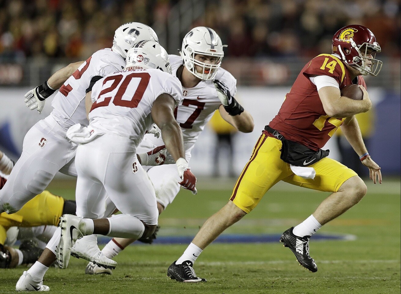 USC quarterback Sam Darnold (14) scrambles against Stanford during the first half of the Pac-12 championship game at Levi's Stadium.