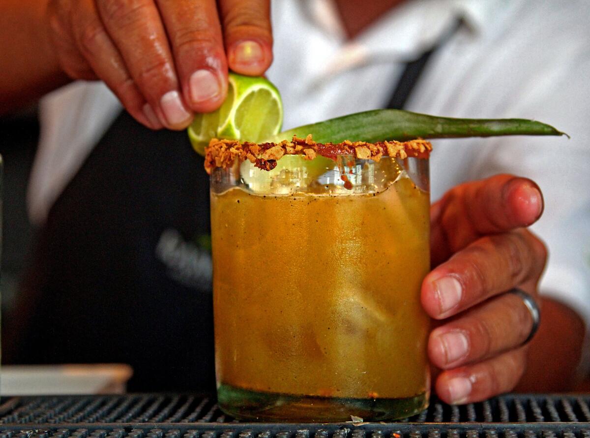 Danny Sanchez, head bartender at Rancho Pescadero in El Pescadero, makes an ancho chile and tequila cockail.