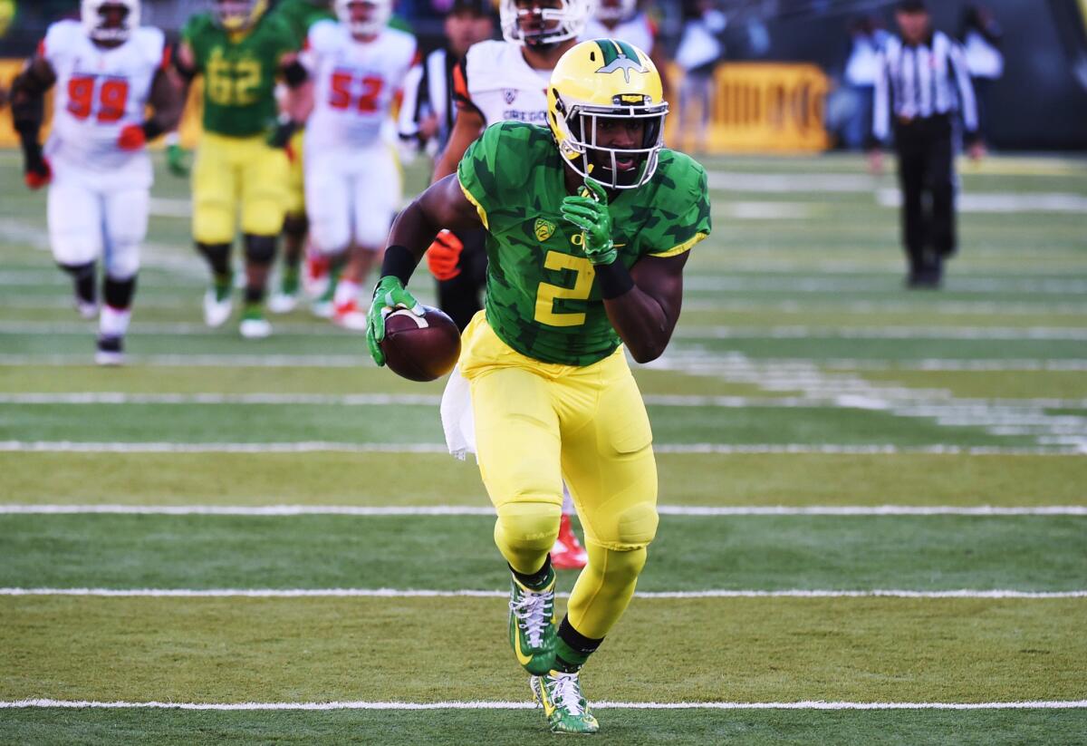 Oregon receiver Bralon Addison runs for a touchdown after catching a pass against the Oregon State Beavers.