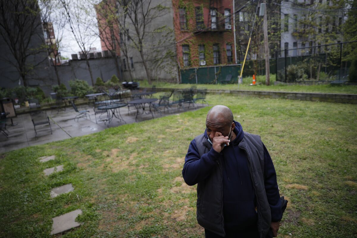 Milton I., 50, who lives with schizophrenia in Brooklyn, wipes his eyes as he speaks about the loneliness caused by social distancing. Experts fear COVID-19 will worsen the nation's mental health crisis.