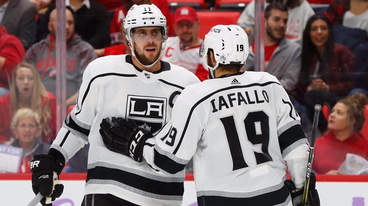 Kings center Anze Kopitar (11) celebrates his goal against the Detroit Red Wings with Alex Iafallo (19) in the third period Tuesday.