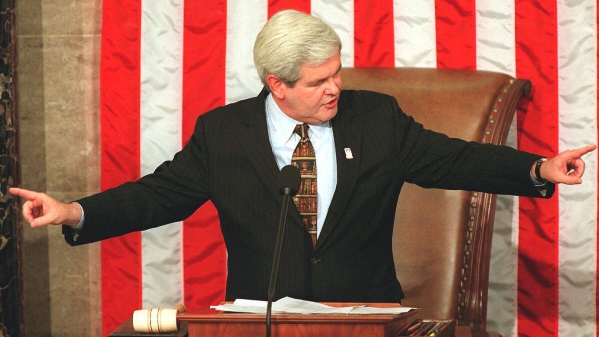 House Speaker Newt Gingrich gestures while addressing the opening session of the 105th Congress on Capitol Hill in Washington on Jan. 7, 1997.