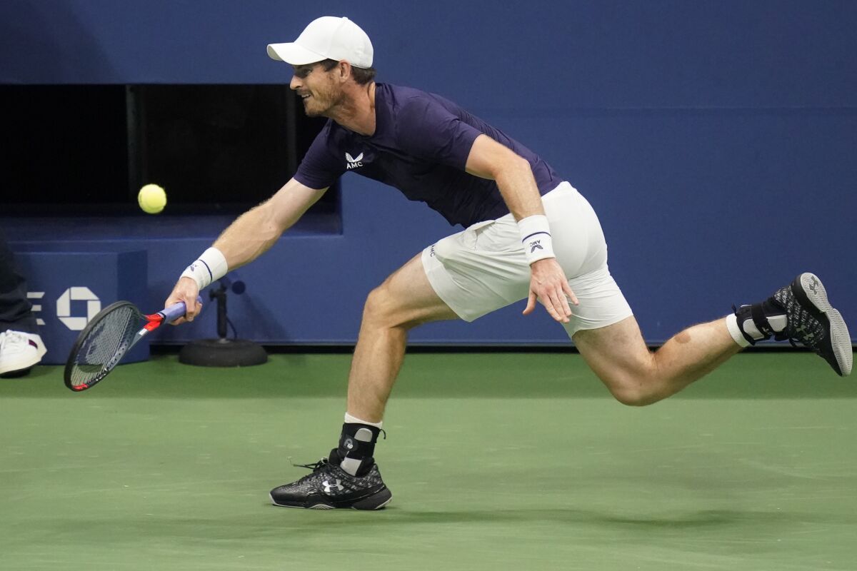 Andy Murray, of Great Britain, returns a shot to Felix Auger-Aliassime, of Canada, during the third round of the U.S. Open tennis championships, Thursday, Sept. 3, 2020, in New York. (AP Photo/Frank Franklin II)