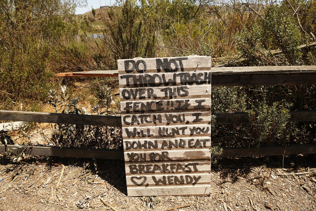 A sign placed by Wendy Lockett warns people living in campers near the Ballona Wetlands.