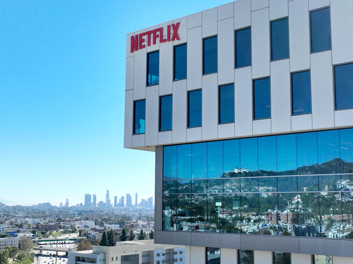Netflix Front View Netflix agrees to buy Warner Bros. in an $82.7-billion deal that will ...