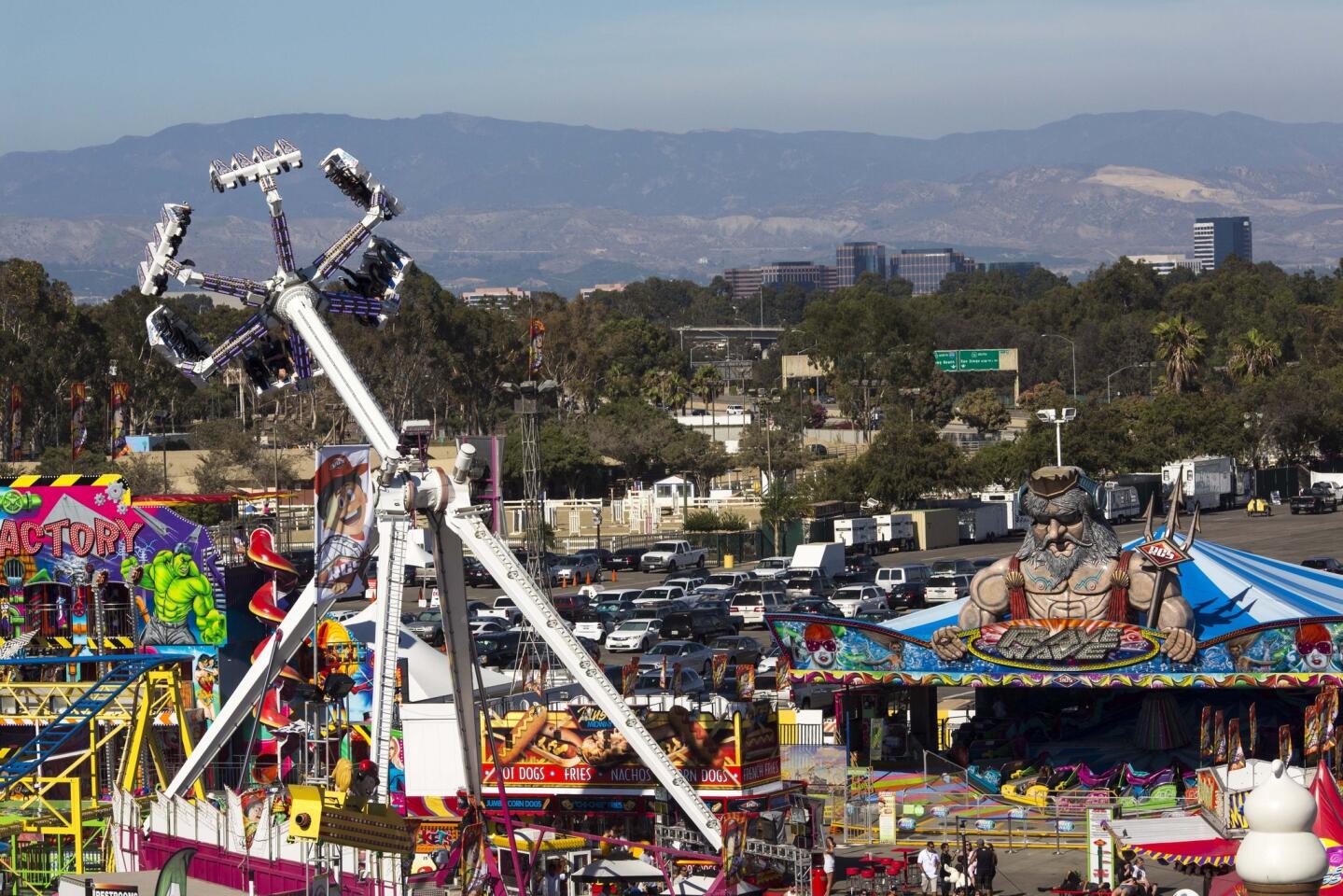 Fairgoers enjoy entertainment, rides, games, animals and deep-fried splendor on Friday, the first day of the Orange County Fair.