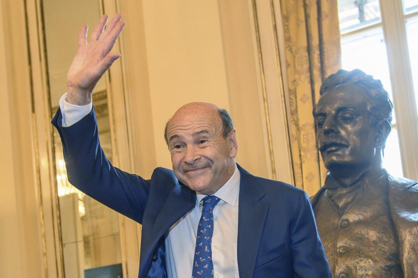 Dominique Meyer gestures, during a press conference to present the 2024/2025 Opera, Ballet and Concert Season of La Scala Theater, in Milan, Tuesday, May 28, 2024. The general manager of Milan’s famed Teatro alla Scala bade a bittersweet farewell to the theater during the presentation of 2024-25 season. (Claudio Furlan/LaPresse via AP)