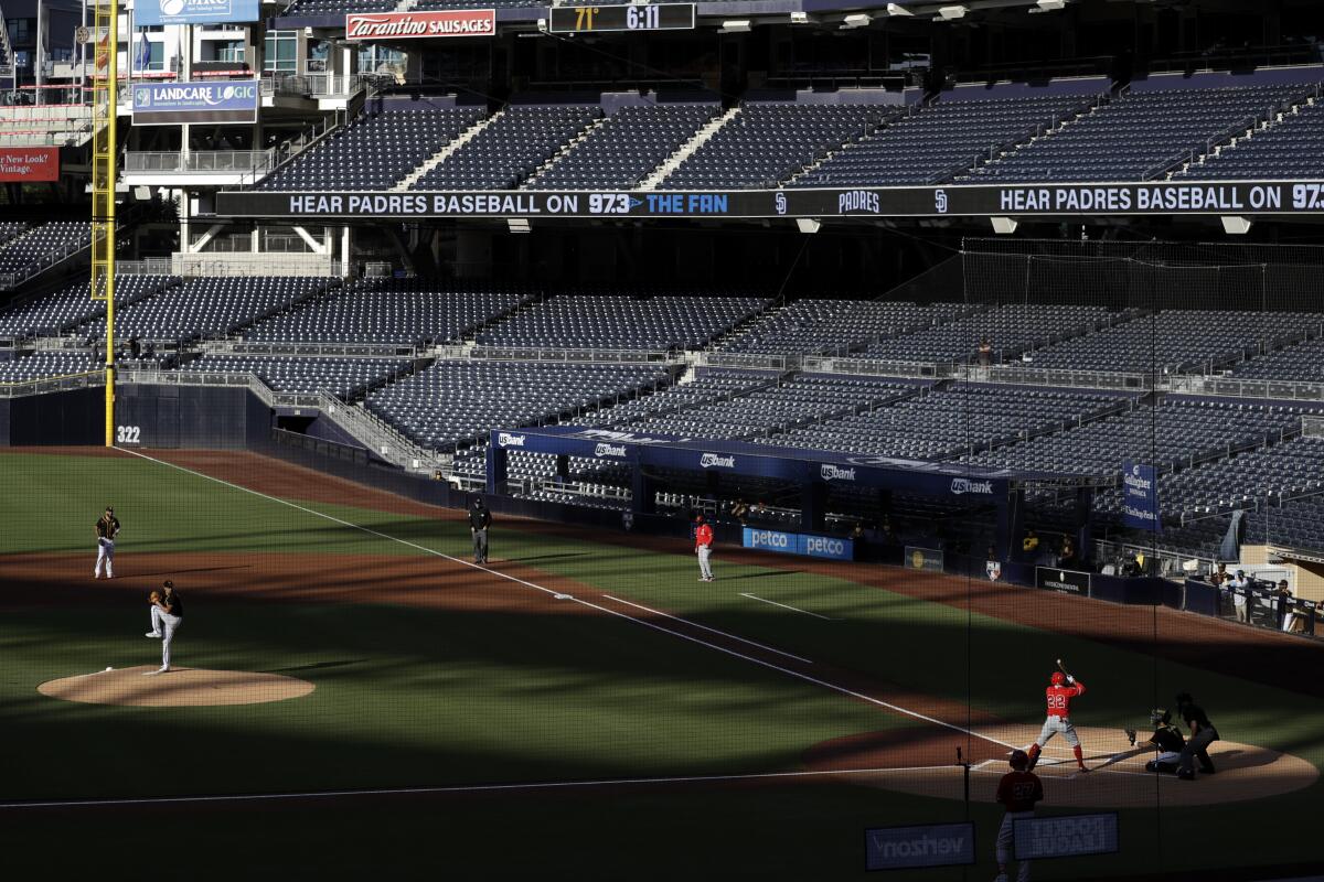 San Diego Padres starting pitcher Garrett Richards throws to Angels batter David Fletcher.