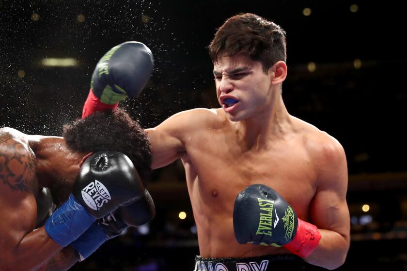 NEW YORK, NEW YORK - DECEMBER 15: Ryan Garcia (R) lands a punch against Braulio Rodriguez (L) during their Super Featherweight bout at Madison Square Garden on December 15, 2018 in New York City. (Photo by Al Bello/Getty Images)