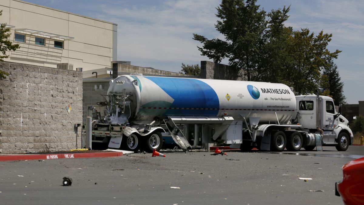 Debris is scattered near a tanker truck carrying liquid oxygen at the Kaiser Permanente medical office building in Santa Rosa, Calif., on Wednesday.