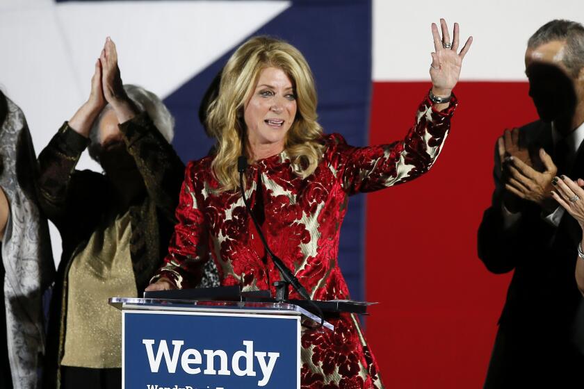 FILE - Then-Texas Democratic gubernatorial candidate Wendy Davis waves to supporters after making her concession speech, Nov. 4, 2014, in Fort Worth, Texas. (AP Photo/Tony Gutierrez, File)