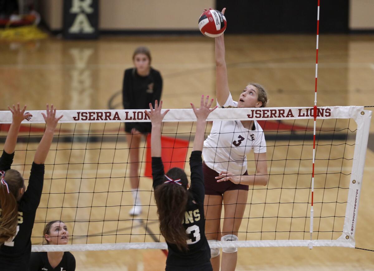 Sophia Reavis of Laguna Beach spikes the ball at JSerra during the first set of a nonleague match on Wednesday.