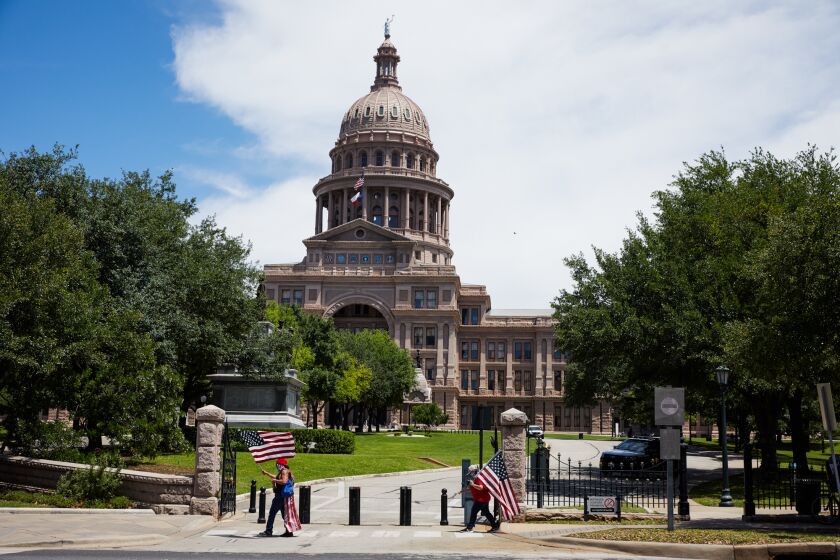 AUSTIN, USA - MAY 01 : A small group of protestors gather outside of the State Capitol on May 01, 2020 demanding all restrictions put in place due to coronavirus (COVID-19) be lifted in Austin, Texas, United States. (Photo by Dave Creaney/Anadolu Agency via Getty Images)