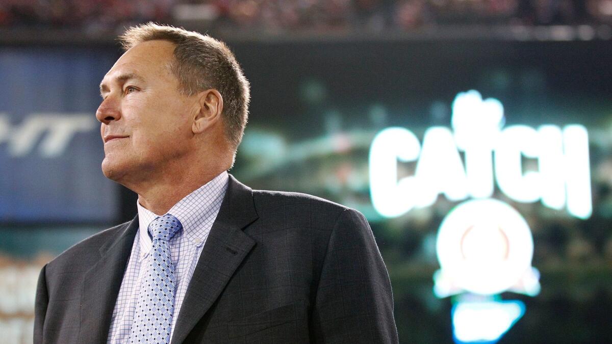 Former San Francisco wide receiver Dwight Clark is honored at halftime of a game between the 49ers and Atlanta Falcons on Dec. 23, 2013.