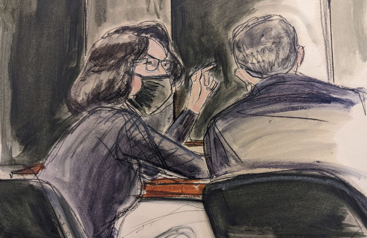 In this sketch, Ghislaine Maxwell, seated left speaks to her defense attorney Christian Everdell prior to the testimony of "Kate,"during the trial of Ghislaine Maxwell, Monday, Dec. 6, 2021, in New York. Maxwell 's family have written to Attorney General Merrick B. Garland requesting that authorities stop using four-point restraints to shackle her hands, waist and feet when she is moved from a holding cell to the courtroom, and that she receive a food pack and a bar of soap each day. (Elizabeth Williams via AP)