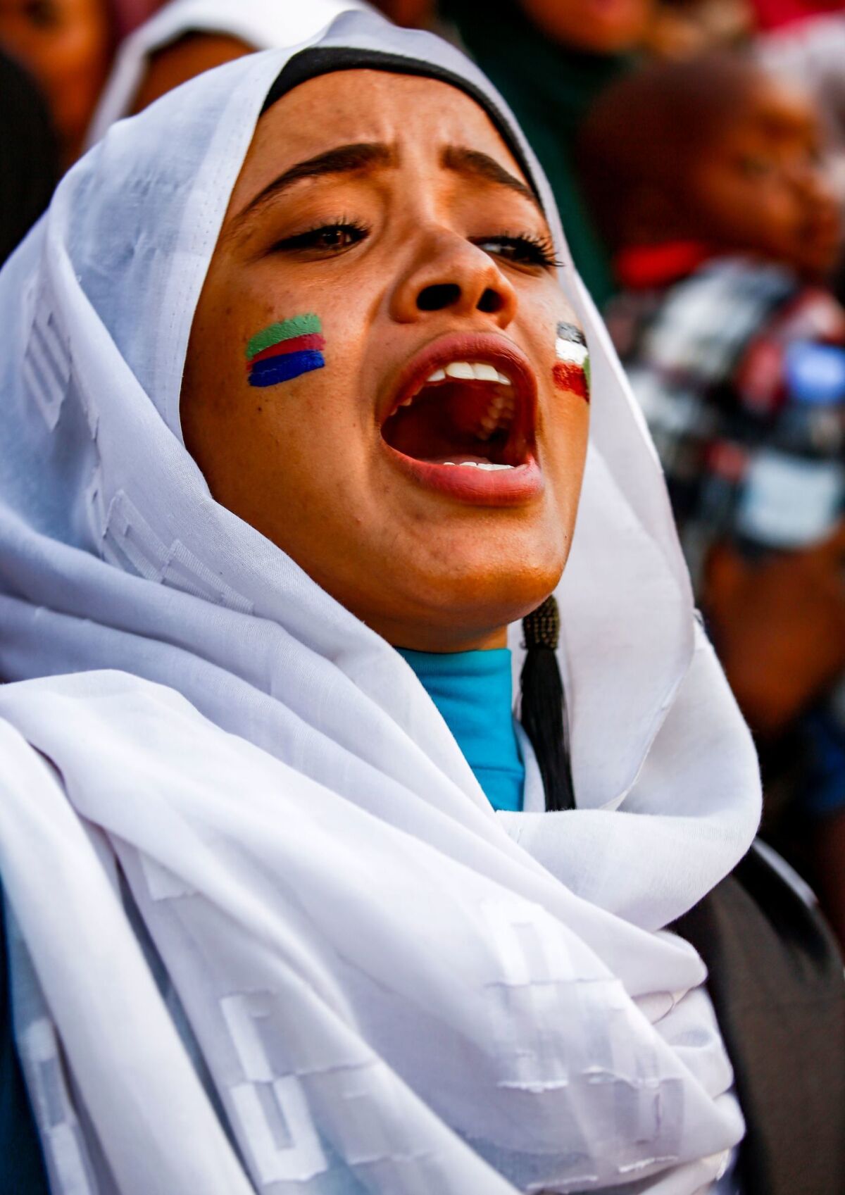 A woman protests Friday outside army headquarters in Khartoum.