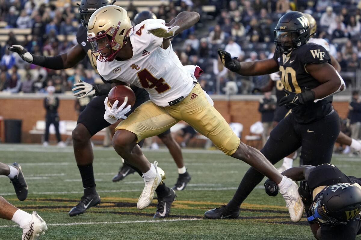 Boston College wide receiver Zay Flowers (4) breaks a Wake Forest tackle for a long gain after a catch in October.