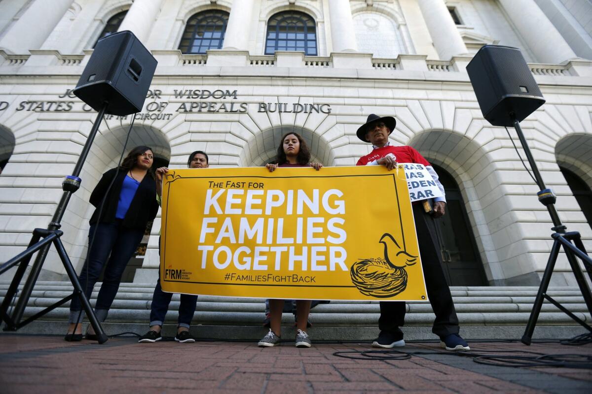 Immigration activists protest outside the federal appeals court in New Orleans on Oct. 14, 2015.