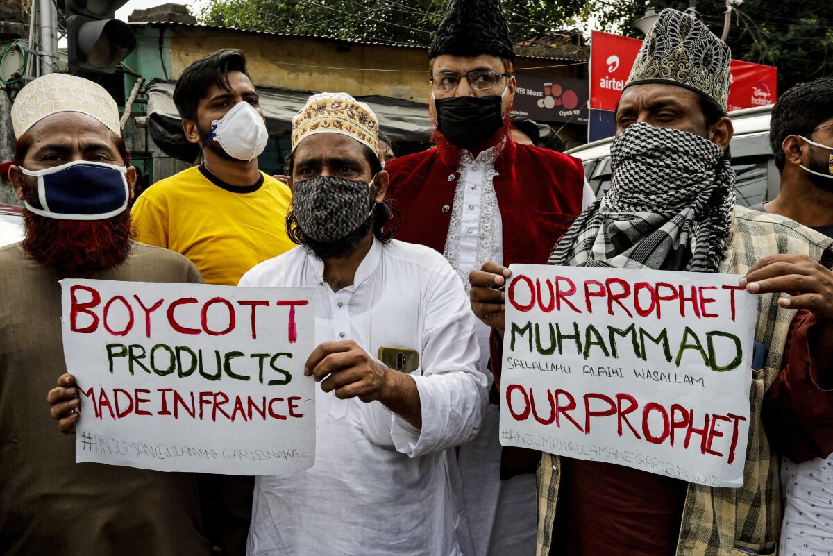Muslim activists from various organizations participate in a protest against France, near the French Consulate, in Kolkata, India, Saturday, Oct. 31, 2020. Muslims have been calling for both protests and a boycott of French goods in response to France's stance on caricatures of Islam's most revered prophet. (AP Photo/Bikas Das)
