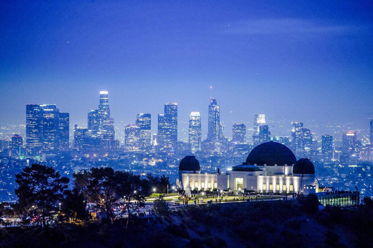 View of the L.A. skyline with the Griffith Observatory in the foreground