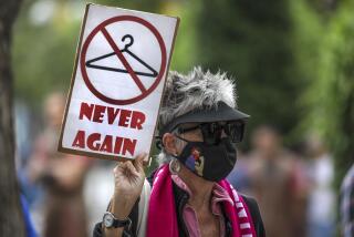 Santa Monica, CA - July 16: Carolyn, who refused to give her last name, joins abortion-rights rally at Planned Parenthood-Santa Monica Health Center on Saturday, July 16, 2022 in Santa Monica, CA. (Irfan Khan / Los Angeles Times)