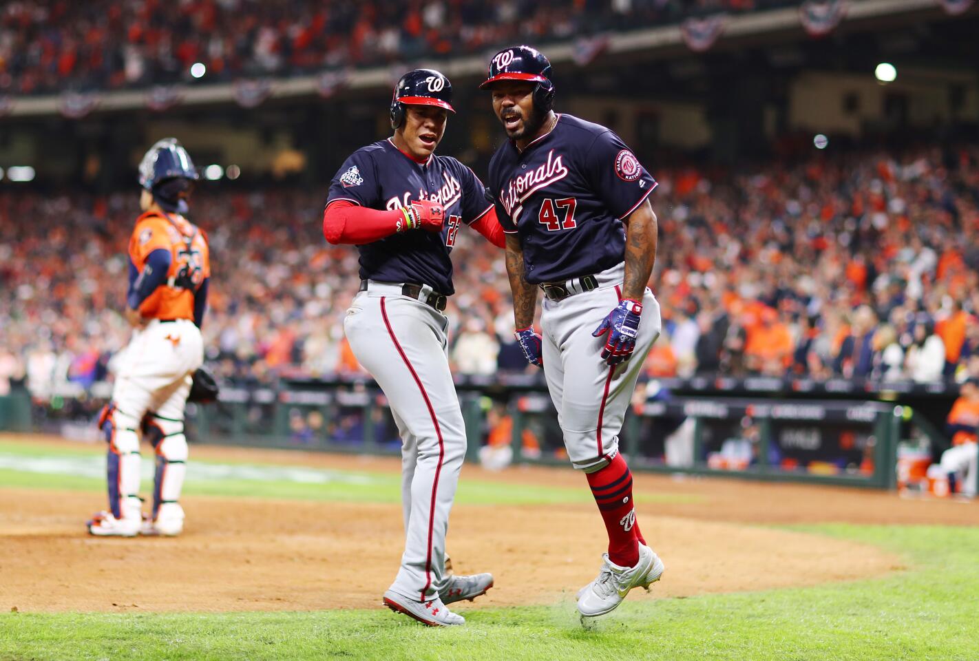 Washington Nationals' Howie Kendrick reacts after hitting a two-run home run