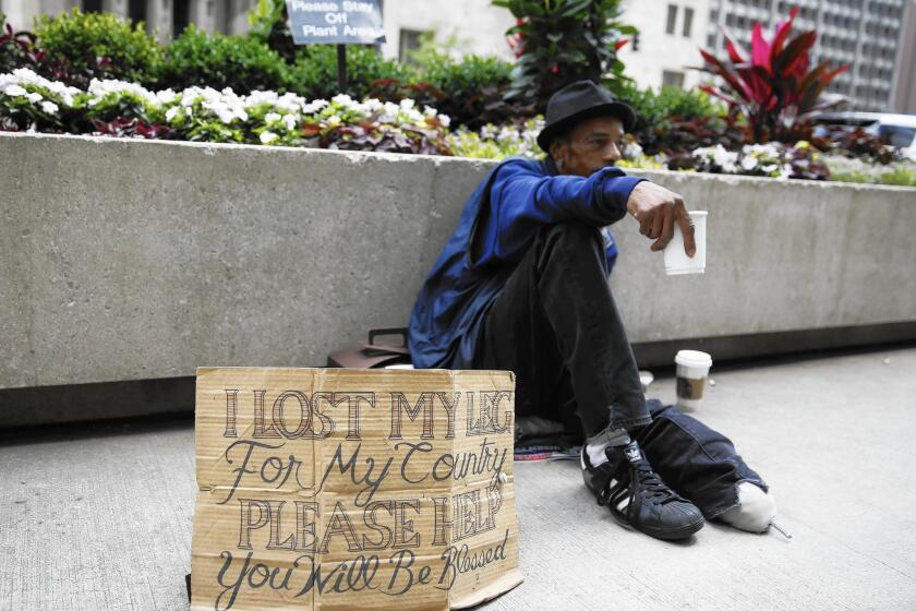 A homeless veteran in downtown Chicago in July.