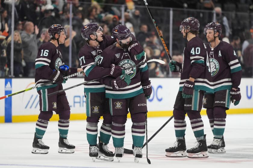 The Ducks celebrate the team's win over the Ottawa Senators Wednesday in Anaheim