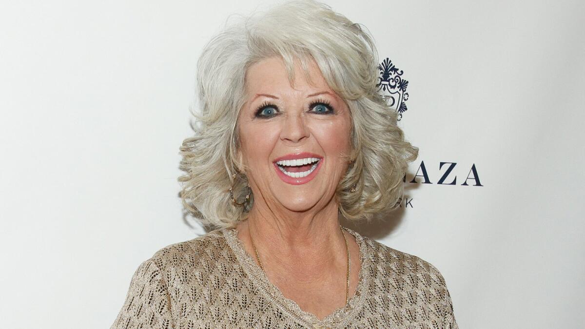 A spokesman for Paula Deen said the celebrity chef wasn't the one who posted a 2011 photo on her Twitter account Tuesday showing her son in brownface as Ricky Ricardo to her Lucy. The tweet was quickly taken down.