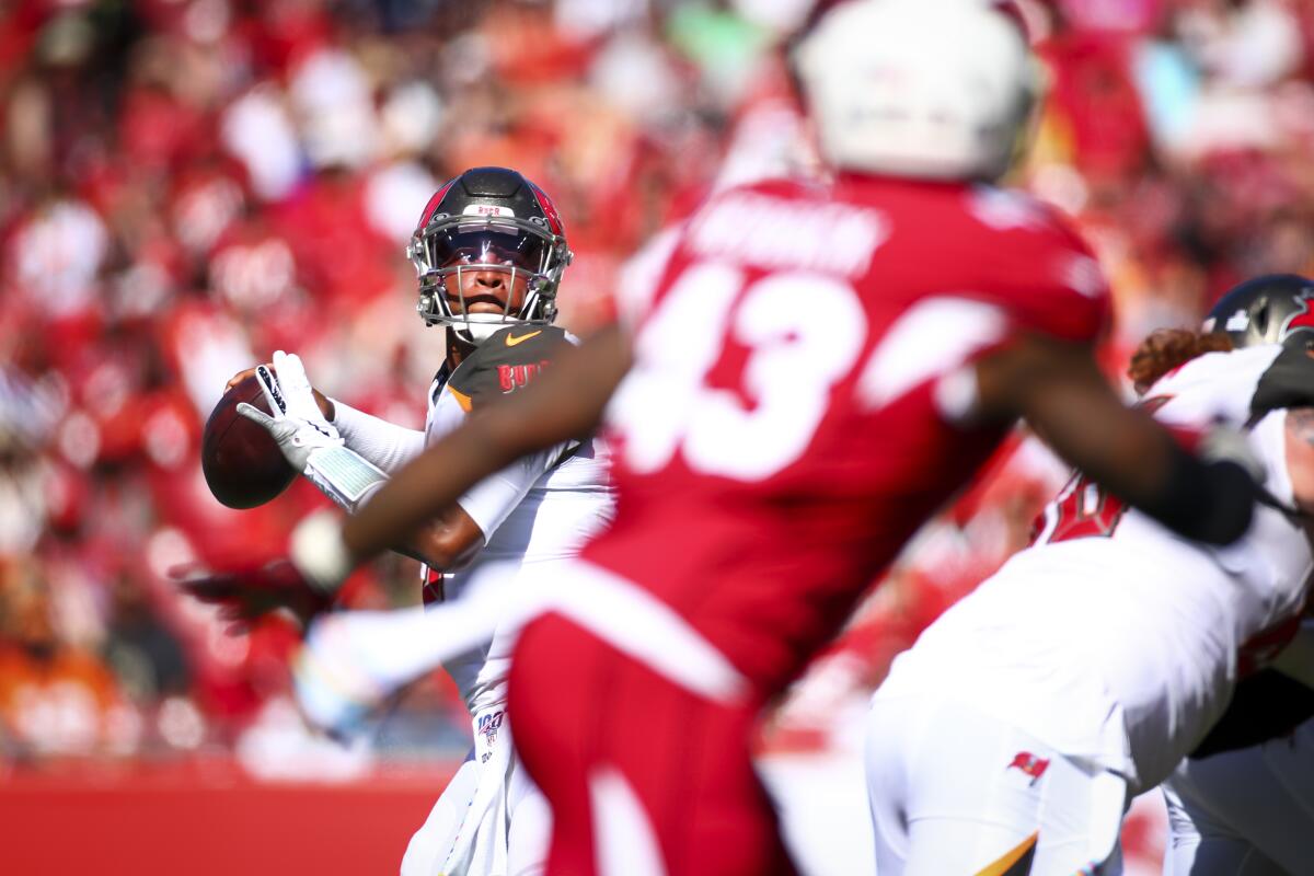 Tampa Bay Buccaneers quarterback Jameis Winston looks to pass against the Arizona Cardinals.