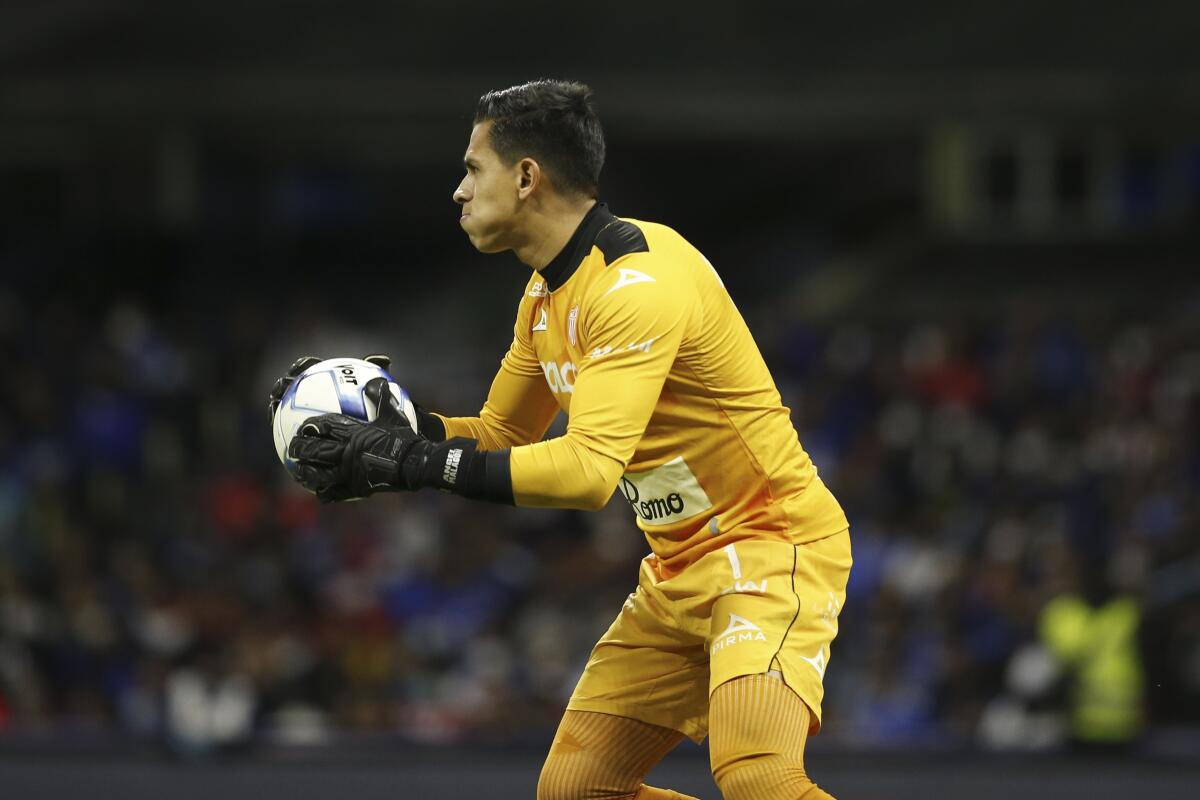 Necaxa's goalkeeper Luis Malagon hold the ball during a Mexican.