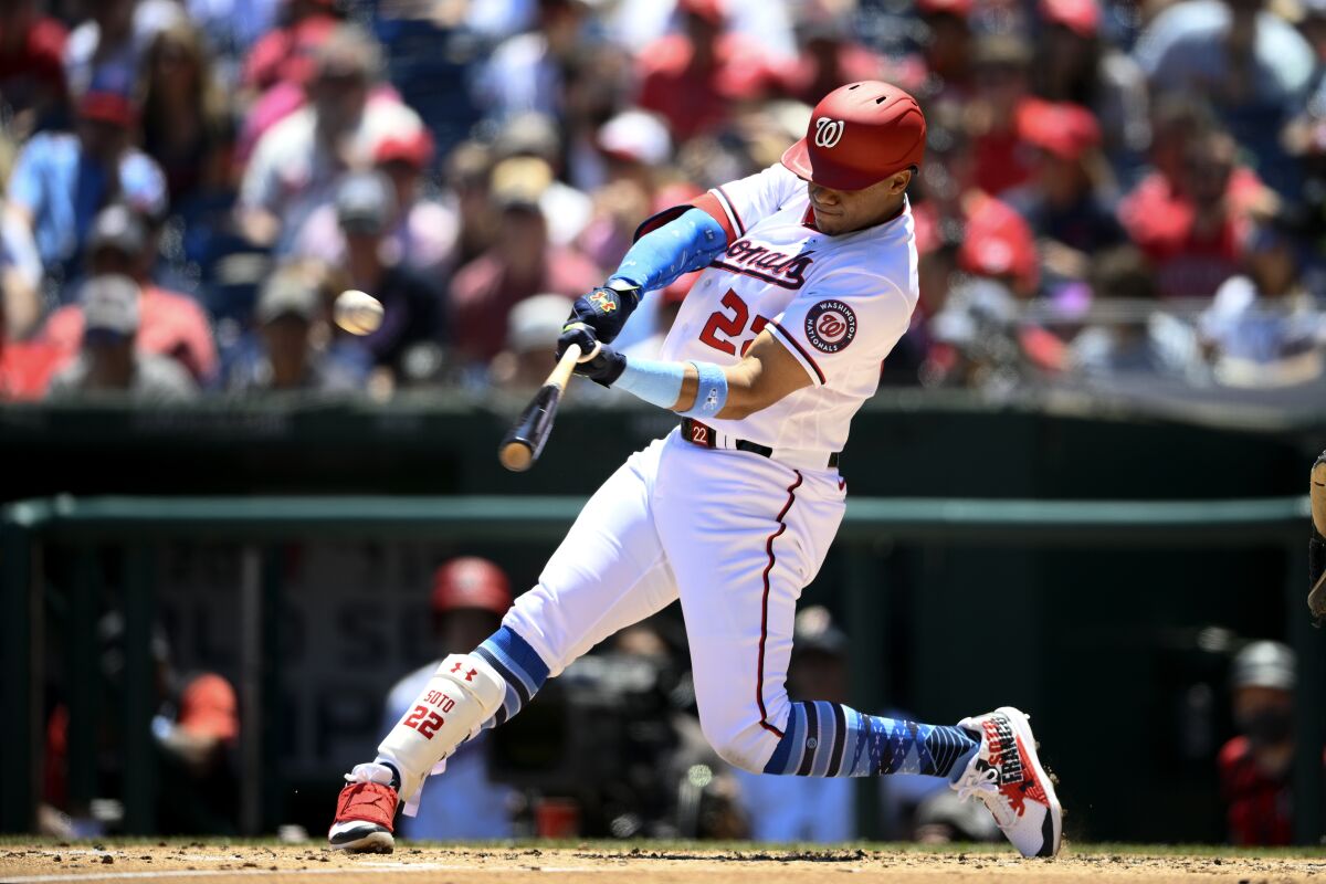 Washington Nationals' Juan Soto hits a three-run home run during the second inning of a baseball game against the Philadelphia Phillies, Sunday, June 19, 2022, in Washington. (AP Photo/Nick Wass)