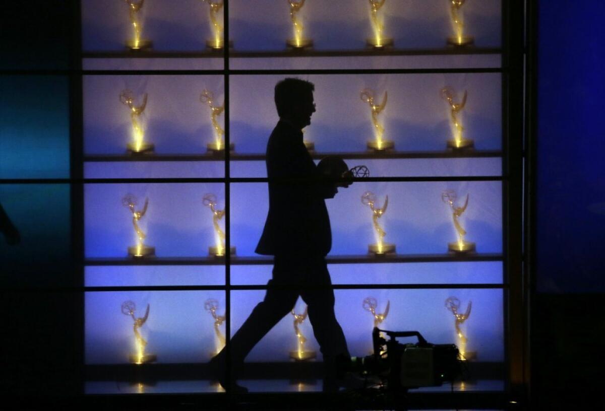 Stephen Colbert exits the stage after winning the Emmy for outstanding writing for a variety series.