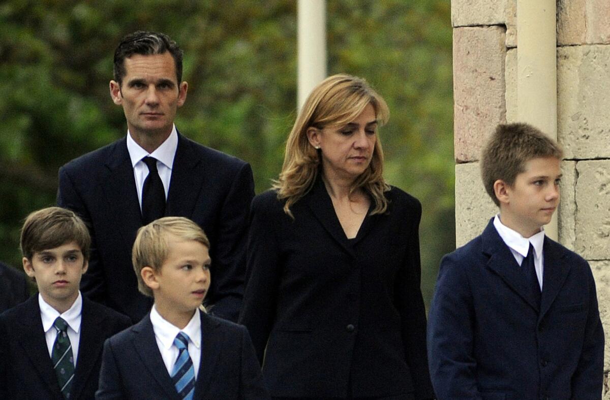Spain's Princess Infanta Cristina, shown in May 2012, with her husband Iñaki Urdangarin and their children at the funeral of Urdangarin's father. The princess has been summoned to testify in a corruption case involving her husband.