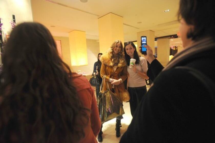 Whitney Port poses with fans in the W Hotel in Times Square in Manhattan.