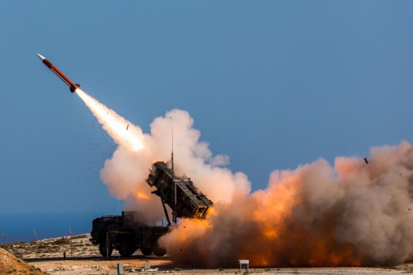 FILE - In this image released by the U.S. Department of Defense, German soldiers assigned to Surface Air and Missile Defense Wing 1, fire the Patriot weapons system at the NATO Missile Firing Installation, in Chania, Greece, on Nov. 8, 2017. U.S. officials say the Pentagon is expected to announce that it will provide about $6 billion in long-term military aid to Ukraine. It will include much sought after munitions for Patriot air defense systems and other weapons. (Sebastian Apel/U.S. Department of Defense, via AP, File)