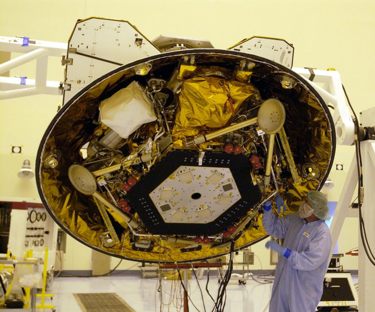 A technician makes checks on NASA's Phoenix Mars Lander 