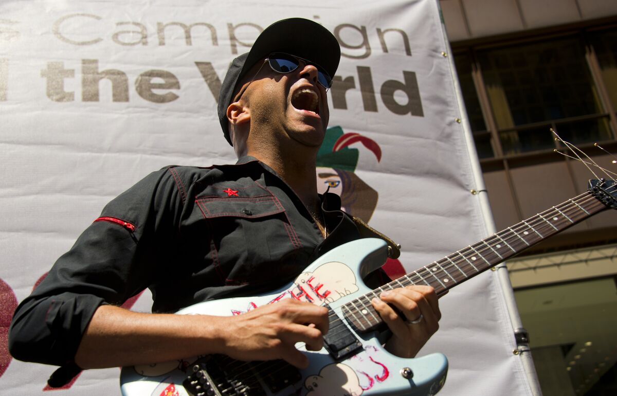 Rage Against the Machine's Tom Morello with guitar in hand.