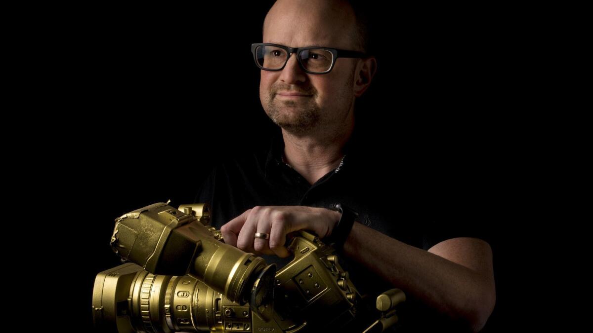 Brian Volk-Weiss holding one of the first cameras that his Comedy Dynamics bought to shoot stand-up specials.