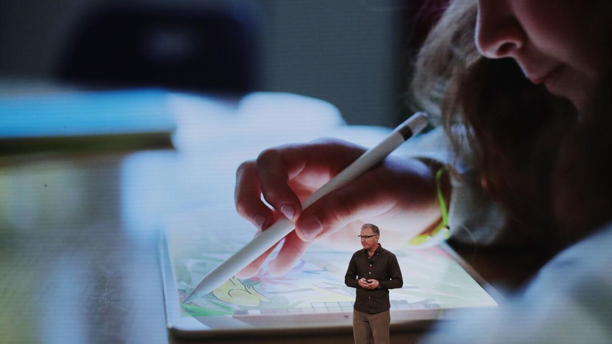 Greg Joswiak, vice president of product marketing at Apple, talks about the new iPad during a March 27 event in Chicago.
