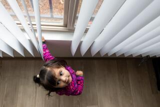 Bakersfield, CA - February 16: Rosalinda Fernandez, 2, opens the blinds in an empty apartment at Cornerstone, a former church converted into housing by the Housing Authority of the County of Kern for young people transitioning out of foster care and operated by Covenant Community Services on Friday, Feb. 16, 2024 in Bakersfield, CA. (Brian van der Brug / Los Angeles Times)